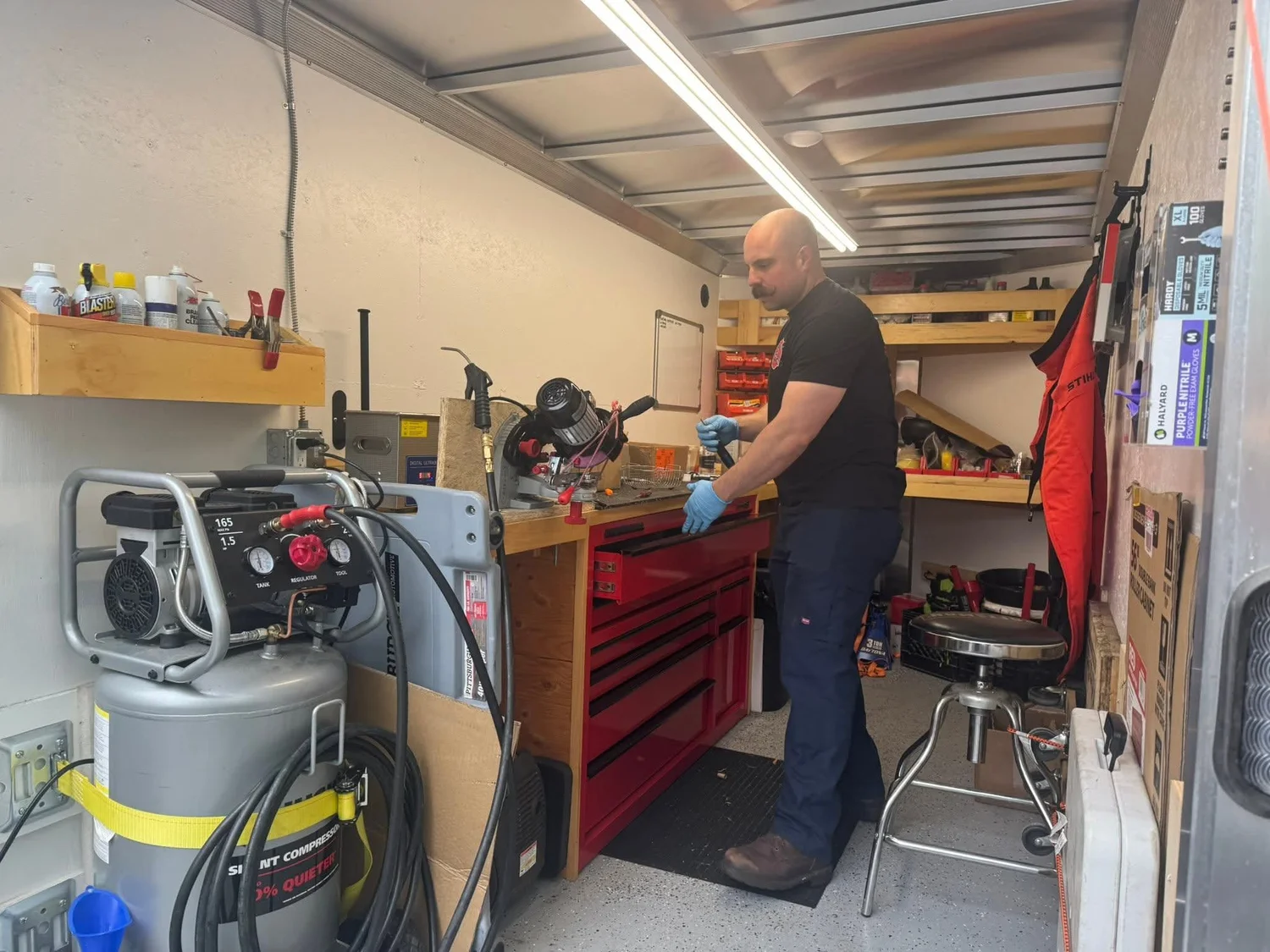 John Bateman working in the mobile service trailer